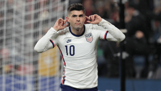 Christian Pulisic points to his two ears as he listens to the crowd at a USMNT match in file photo. FIFA World Cup 2026 Profile: Christian Pulisic